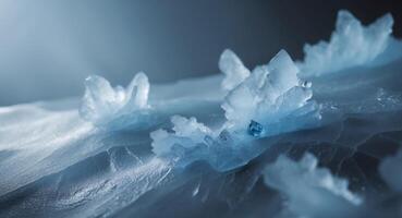 A blue crystal is sitting on top of some ice photo