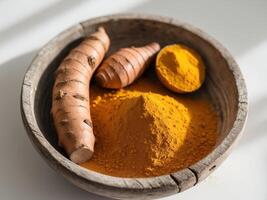 Turmeric Roots and Powder in Rustic Wooden Bowl, Closeup Still Life Composition. photo