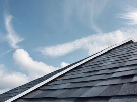 Closeup of a Roof with Asphalt Shingles under a Blue Sky with Clouds, Daytime. photo