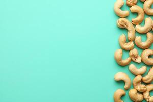 Top View Of Roasted Cashews On Vibrant Background With Copy Space, Food Setting photo