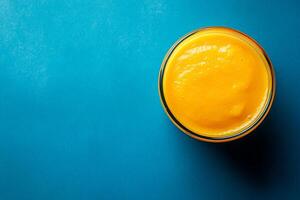 Top View Of Mango Smoothie On Vibrant Background With Copy Space, Cuisine Photography photo