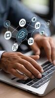 Man using laptop with icons on the screen photo