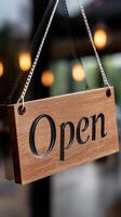 Open sign hanging on a wooden door photo