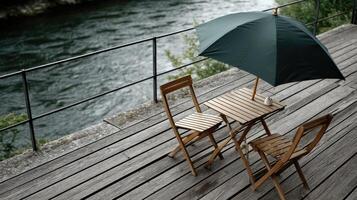 A wooden table and chairs on a wooden deck photo