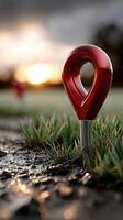 A red marker on the ground photo