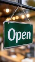 Open sign hanging on a restaurant window photo