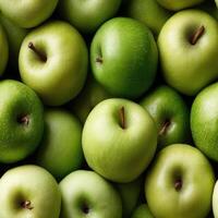 Close-up view of fresh green apples surrounded by leaves, showcasing their vibrant color and texture, perfect for food-related projects SEAMLESS PATTERN photo