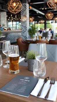 A table with a menu and glasses of beer photo