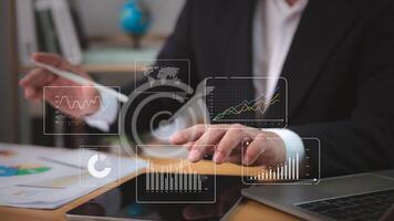 Businessman analytics with key performance indicators, Analyzing company network, Working Data analytics and data management systems and connected to corporate strategy database for finance investment photo