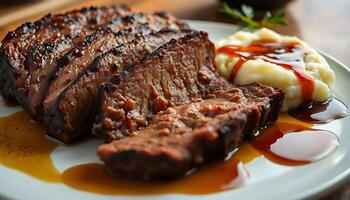 white plate topped with meat and mashed potatoes photo