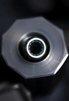 close up of a metal object with a light on it photo