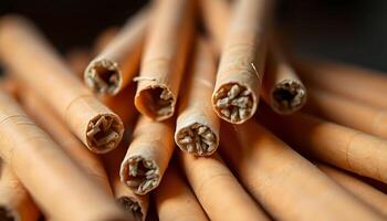 pile of cinnamon sticks sitting on top of a table photo