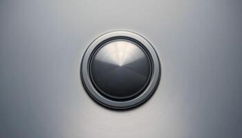 close up of a button on a metal surface photo