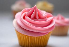 close up of a cupcake with pink frosting photo