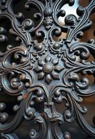 close up of a metal object with intricate designs photo