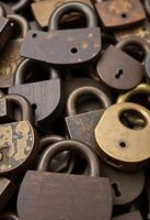 close up of a bunch of old padlocks photo