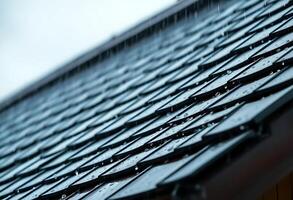 rain falling on a roof of a house photo