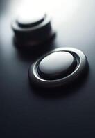 close up of a button on a black surface photo