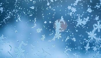 close up of a window with snow flakes on it photo