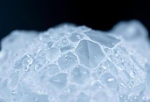close up of water droplets on a piece of ice photo