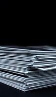 stack of white papers sitting on top of a table photo