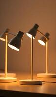 three desk lamps sitting on top of a table photo