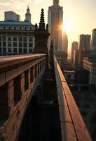 sun is setting over a bridge in a city photo