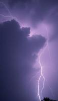 purple sky with a lightning bolt in the middle of it photo