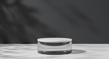 A clear jar sitting on a table with a shadow photo