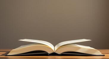 An open book on a table with a brown background photo