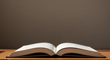 An open book on a table with a light photo