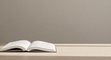 An open book is sitting on a table in front of a wall photo
