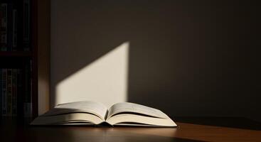 An open book on a table with the sun shining on it photo