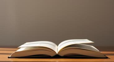 An open book on a table with sunlight streaming in photo
