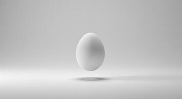 A white egg floating in the air on a white background photo