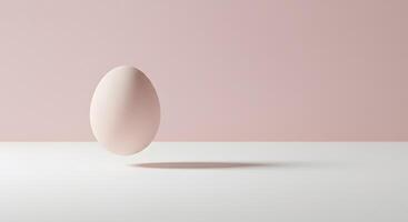 A white egg floating in front of a pink background photo