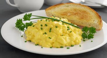 Scrambled eggs with toast on a plate photo