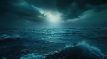 The vast ocean under a dark, dramatic sky, displaying the power of nature's elements. photo