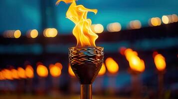 A vivid close-up of a torch with flames dancing in the night, capturing a moment of celebration. photo