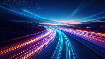 Spectacular view of the highway at night with colorful trails of light in motion. photo