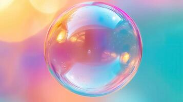 A beautiful, iridescent soap bubble shimmers with a rainbow of colors, close-up. photo