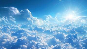 An aerial view of a beautiful, bright blue sky filled with soft, white clouds. photo