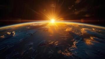 Spectacular view of a sunrise over earth, seen from outer space with bright light. photo