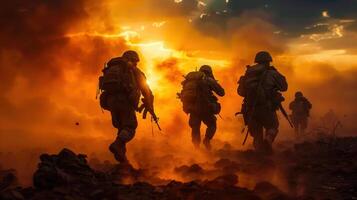 Silhouetted soldiers advance in a fiery war zone under a dramatic, orange-tinted sunset. photo