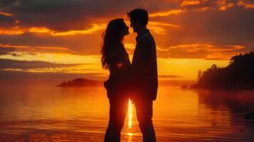 Romantic silhouette of a couple embracing on the beach at sunset, creating a beautiful scene. photo