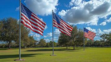 Three american flags waving proudly on a beautiful sunny day, symbolizing freedom and patriotism. photo
