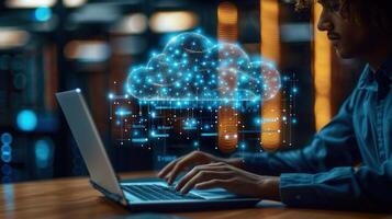 A man working on a laptop with a vibrant cloud computing graphic overlayed, creating an abstract scene. photo