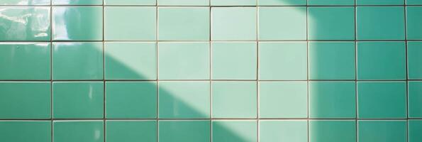Light green tiled wall texture with clean grout and shadow play photo