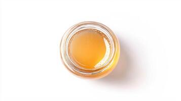 Realistic wildflower honey in glass jar for culinary and natural health use photo