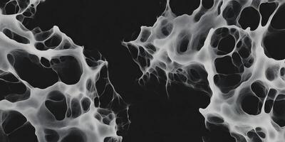 Mottled grayscale texture with sharp edges and deep shadows on a black background photo